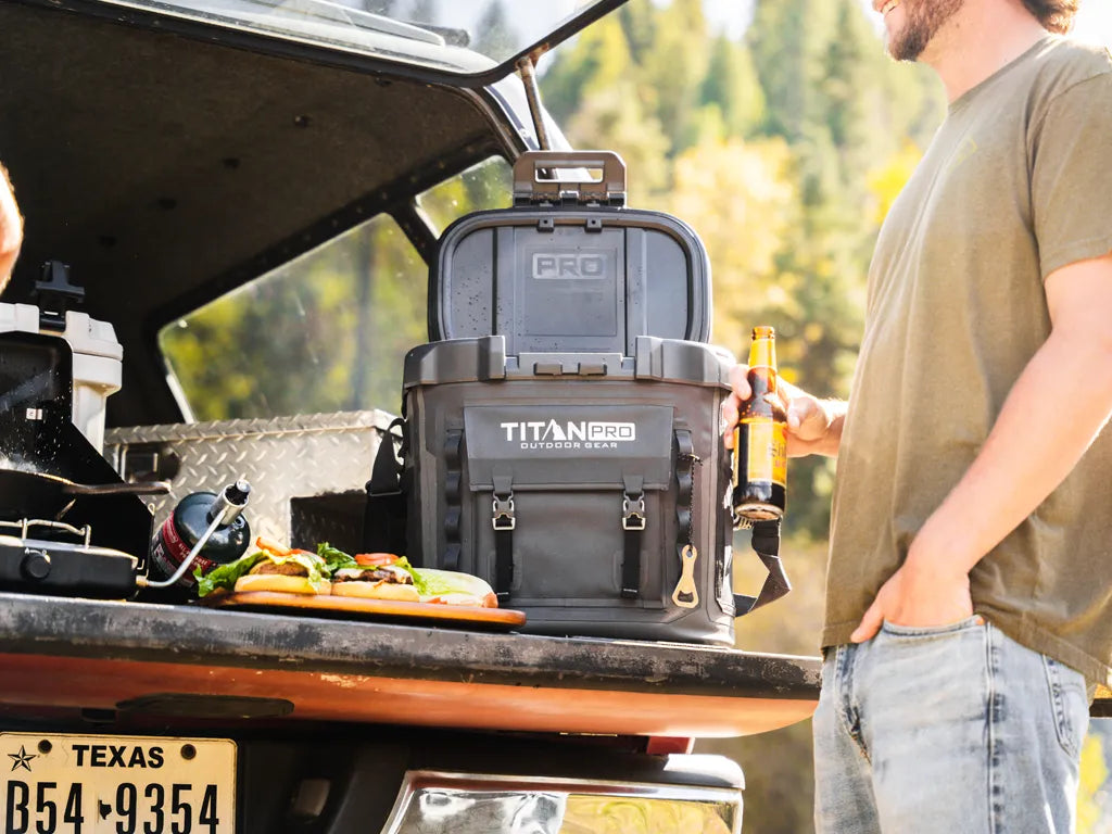 Titan PRO welded cooler next to a camping stove outside