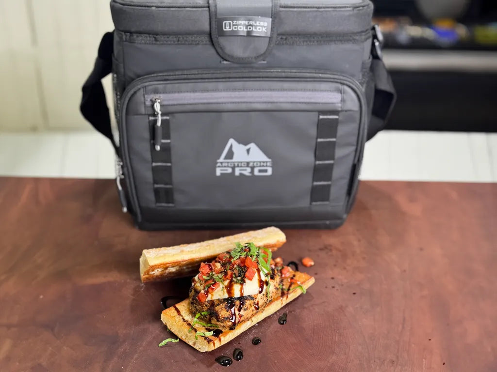 Bruschetta Chicken Sandwich on a table next to a cooler