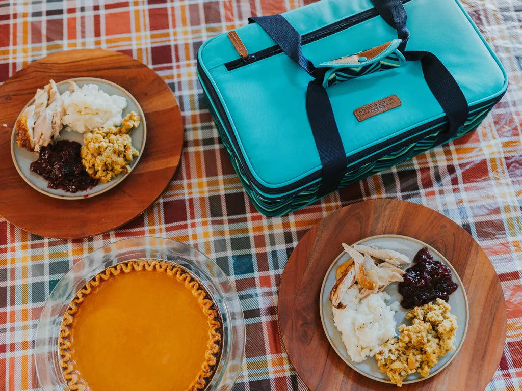 Artic Zone Food Pro Insulated Food Carrier on a table next to a Thanksgiving meal