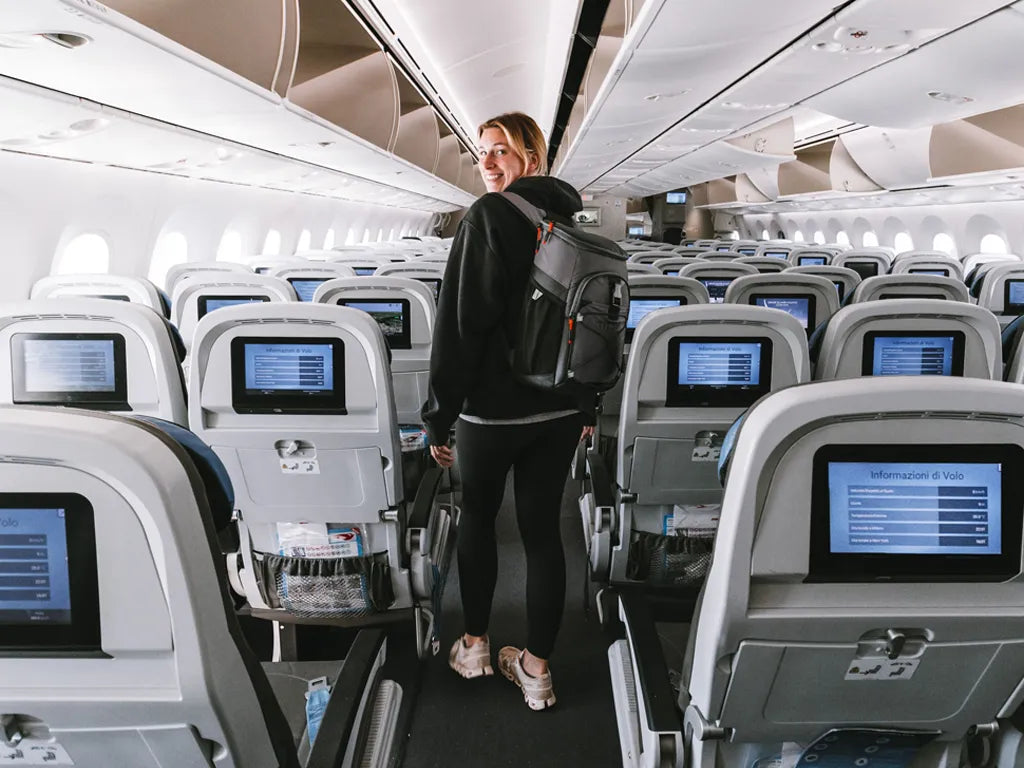 Lady wearing a Titan Backpack Cooler while boarding a plane