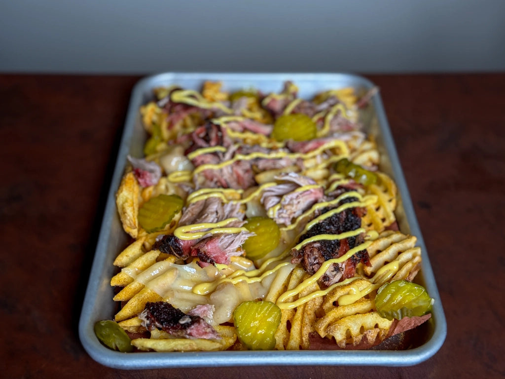 Homemade loaded Cuban fries on a tray.