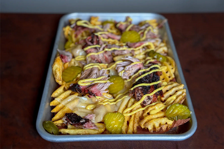 Homemade loaded Cuban fries on a tray.