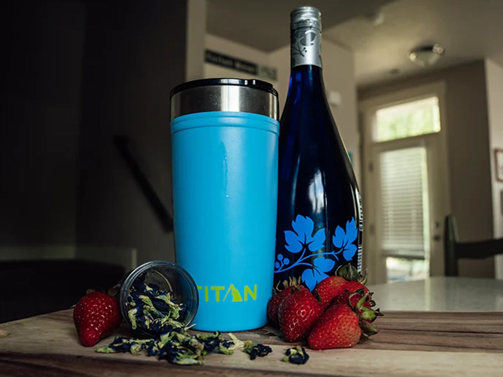 Titan Tumbler on a kitchen counter with strawberry butterfly mimosa ingredients