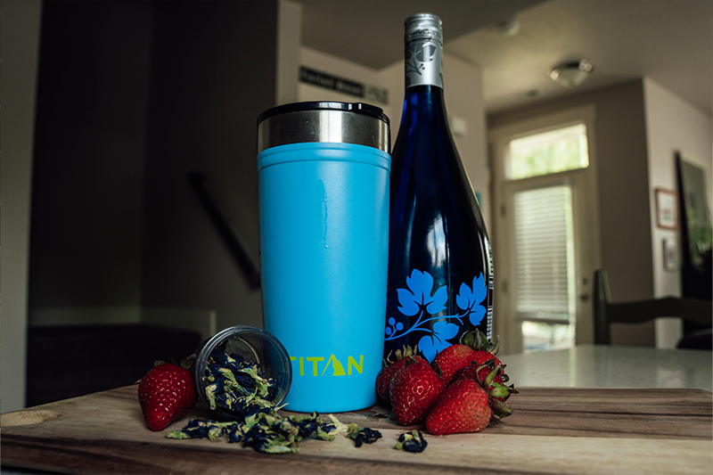 Titan Tumbler on a kitchen counter with strawberry butterfly mimosa ingredients