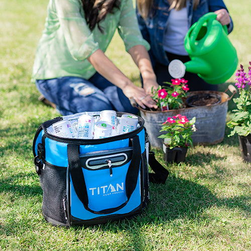 Mom and daughter gardening next to a Titan 24 Can Bucket Tote filled with cold drinks