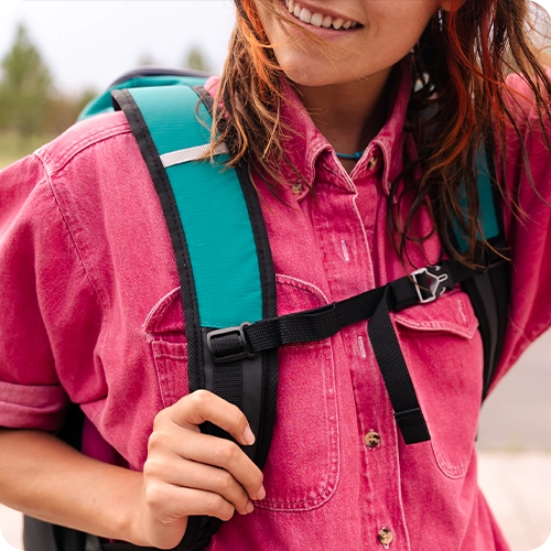 Girl wearing a Titan Backpack Cooler while outside