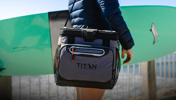 Girl carrying Titan by Arctic Zone Zipperless Soft Sided Cooler
